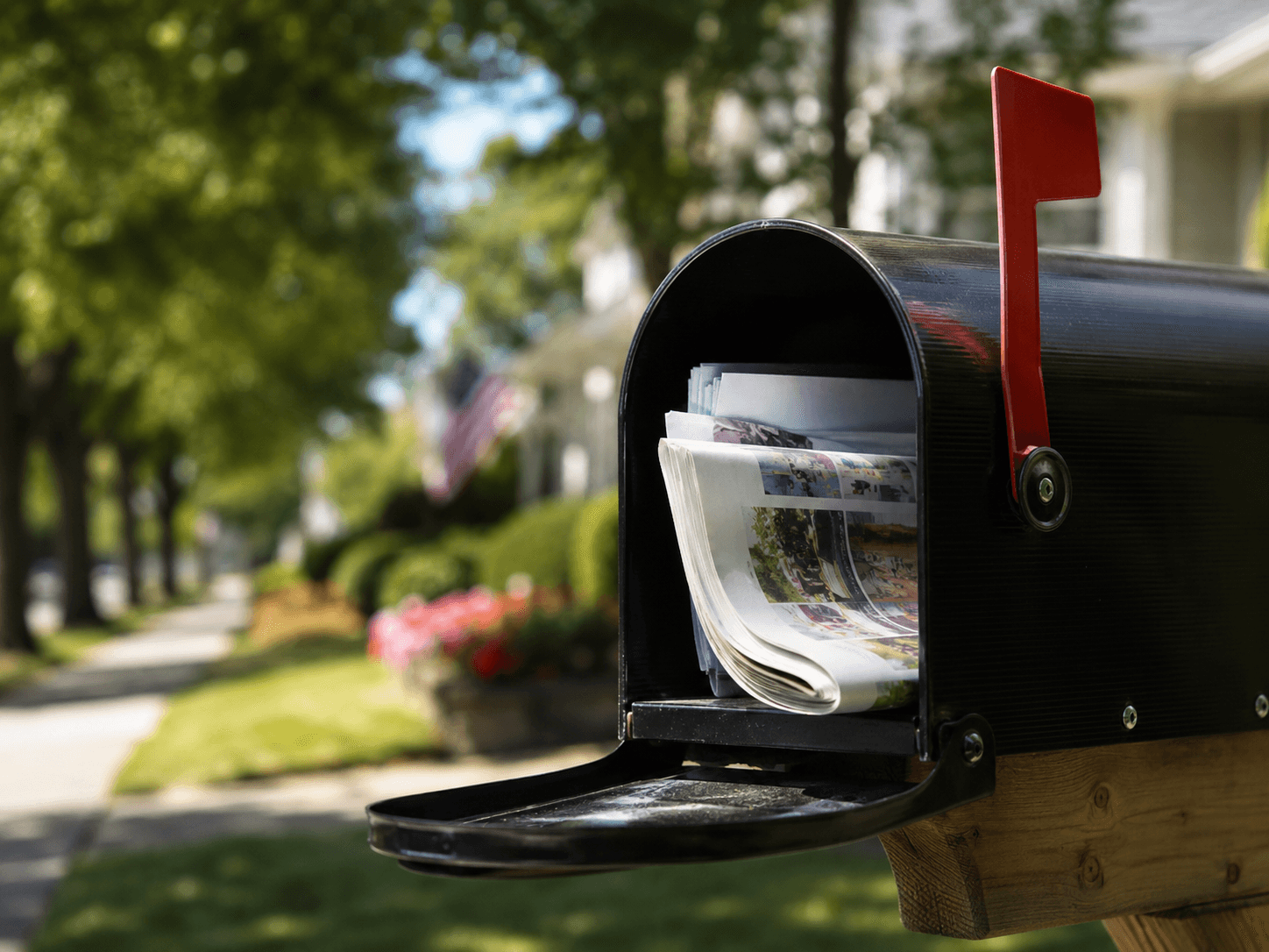 Local newspaper delivered in a mailbox
